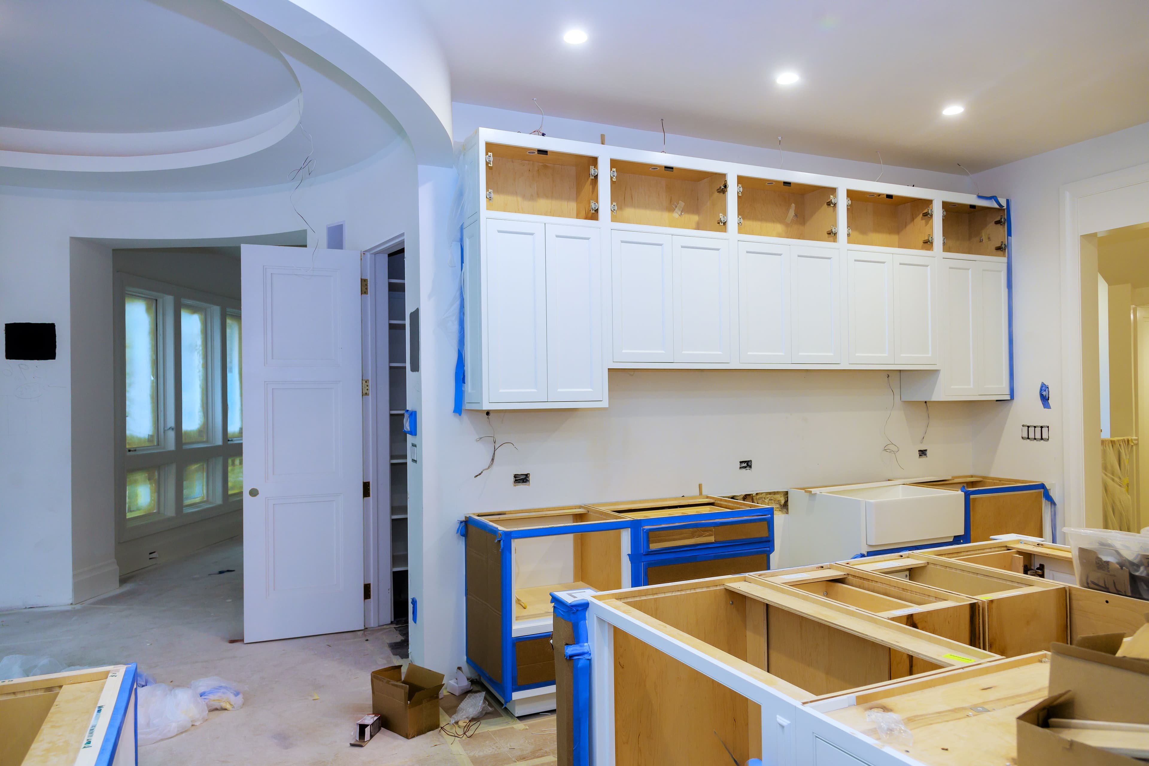 Modern kitchen renovation in progress with cabinetry